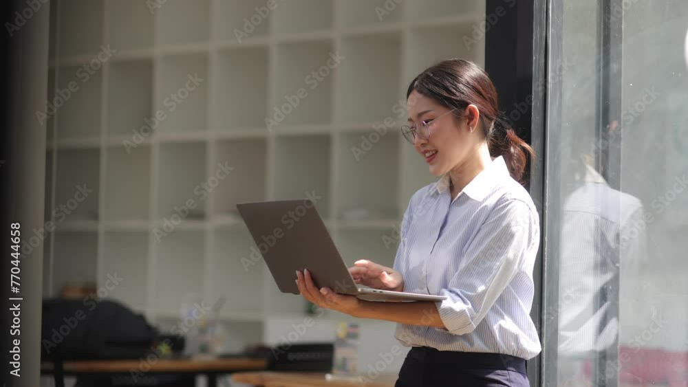 Asian Businesswoman working with laptop at the office. Asian Businesswoman working with laptop at the office.