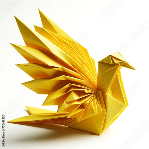 An elegantly crafted origami bird from yellow paper, placed centrally on a white background. The bird's design is intricate, with folds that mimic