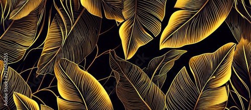 Golden tropical leaves on black background