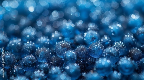  A macro shot of numerous water droplets glistening on a sapphire-like backdrop, fading into bokeh