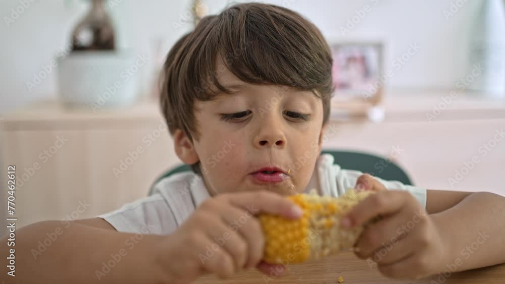 Child Demonstrates The Best Way To Eat Cooked Corn Child Demonstrates The Best Way To Eat Cooked Corn