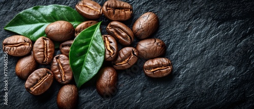  Coffee beans on slate with green leaf