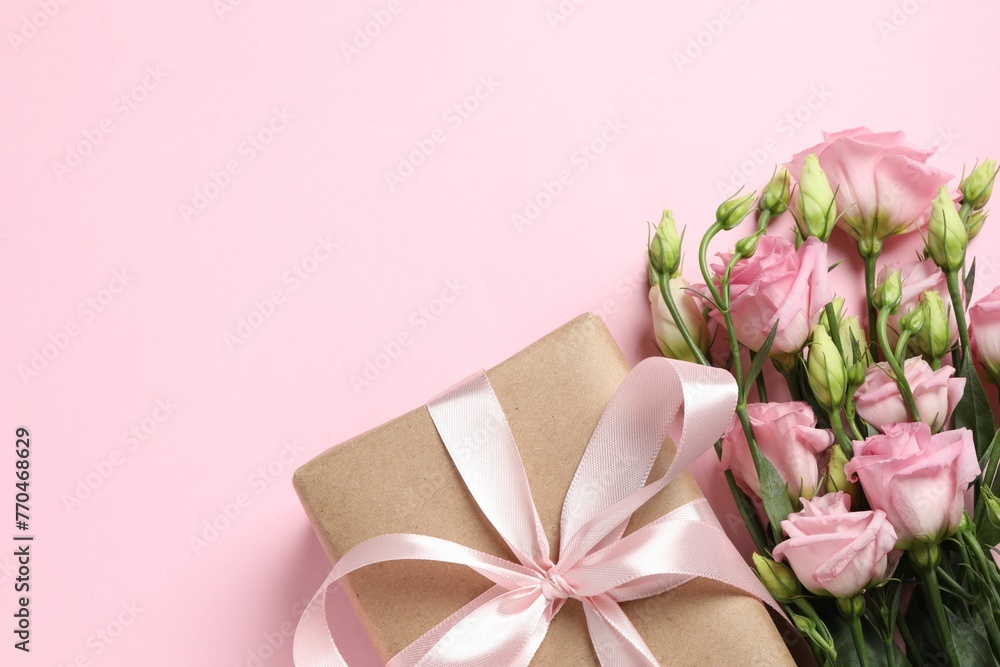 Happy Mother's Day. Beautiful flowers and gift box on pink background, flat lay. Space for text Happy Mother's Day. Beautiful flowers and gift box on pink background, flat lay. Space for text