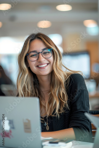 picture of a happy young intern during an internship in an office