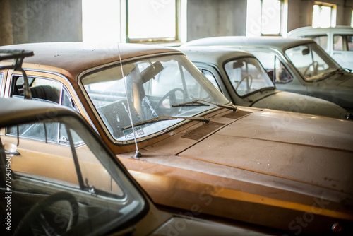 old rusted vintage car collection in barn © ugis