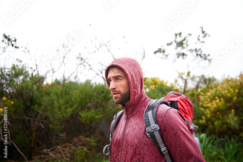Φωτογραφία Extreme, hiking and man in rain, walking and holiday for survival adventure, outdoor and trekking