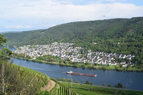 Idyllic Mosel valley with a passing cargo ship