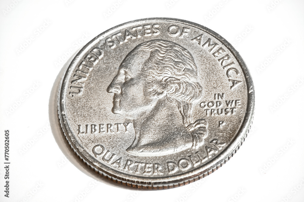 An aged or used Quarter Dollar at 2:1 Magnification, and on a white background. An aged or used Quarter Dollar at 2:1 Magnification, and on a white background.