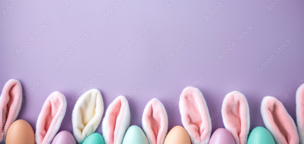 Top view illustration of easter bunny ears colorful vivid eggs and sprinkles on isolated light blue background with copy space, leaving space for text or advertising