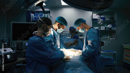 A group of professional surgeons in the operating room. Close-up of a surgical operation. Plastic surgery. Health. Surgery in a private clinic. photo