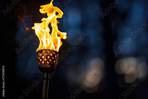 A burning torch in darkness, representing the light of innovation and the path to progress
