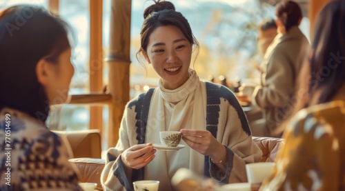 Asian Woman in Mid-40s Fosters Unity Through a Multicultural Tea Ceremony © Breezze