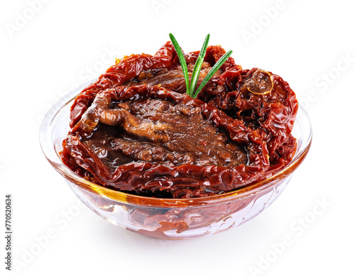 Bowl of sun dried tomatoes isolated on white background. With clipping path.