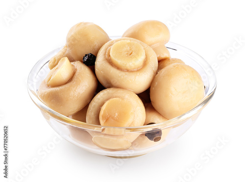 Glass bowl with marinated champignons isolated on white background. With clipping path.