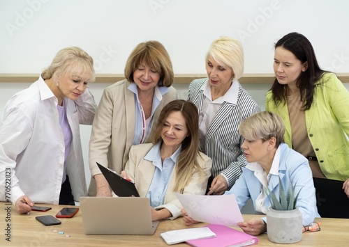 Confident and Successful Businesswomen Strategizing Together in a Professional Office Setting