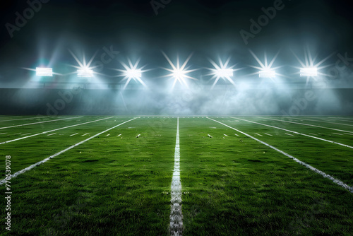 A dramatic American football field illuminated by bright stadium lights  creating sharp contrasts between light and shadow showcasing the green grass and white lines under a dark night sky.