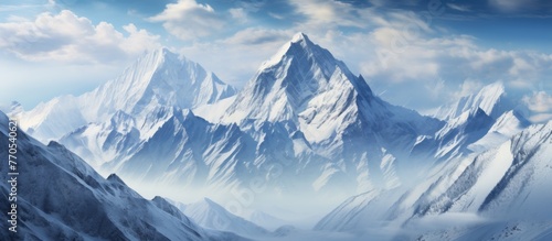 A natural landscape painting featuring a snowy mountain with a blue sky background, showcasing a beautiful mountain range and fluffy white clouds © AkuAku