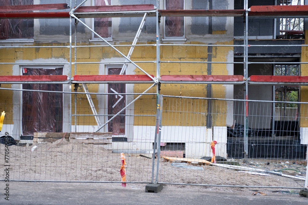Naklejka premium house construction site with scaffolding
