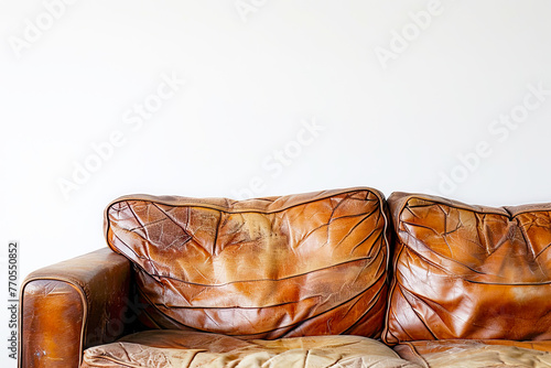 Old leather sofa isolated in a white background photo