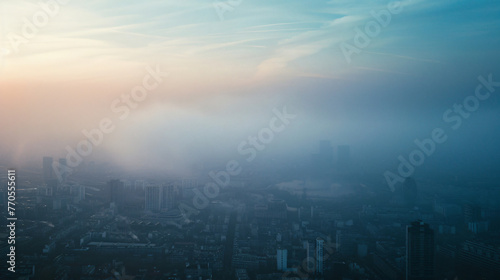 A cityscape showing smog and pollution hanging over the city reducing visibility and air quality.