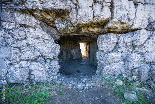 Entrance to the old destroyed second World War bunker. Cracked concrete with protruding reinforcing wires. Wegierska Gorka, South Poland. 