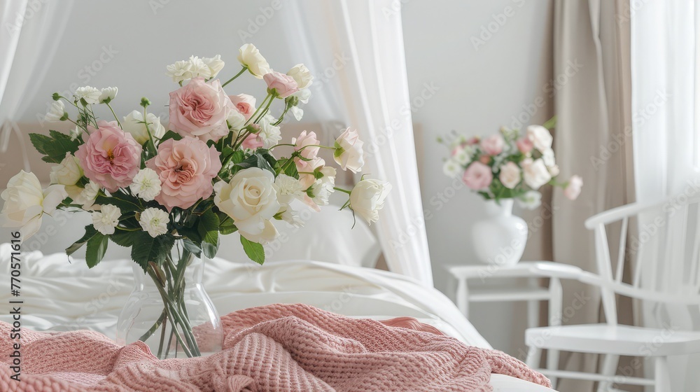 Flowers in vase next to canopy above bed with pink blanket in bedroom with white chair - obrazy, fototapety, plakaty 