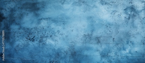 An upclose view of an electric blue wall against a cloudy sky creates a freezing horizon. The natural landscape meets the meteorological phenomenon in darkness, with reflections resembling an ocean