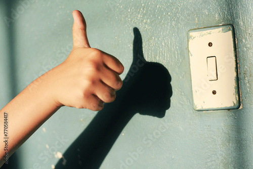 Thumb up next to the light switch.