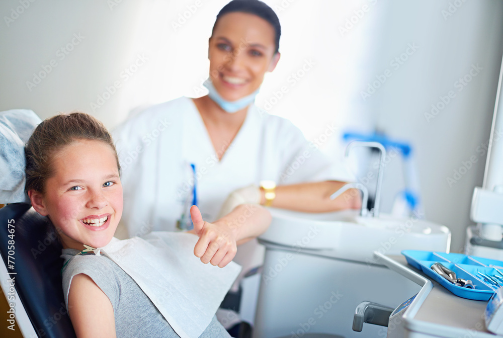 Thumbs up, dentist and portrait of child in chair for cleaning, teeth whitening and wellness. Healthcare, dentistry and woman and girl with emoji for dental hygiene, oral care and medical services Thumbs up, dentist and portrait of child in chair for cleaning, teeth whitening and wellness. Healthcare, dentistry and woman and girl with emoji for dental hygiene, oral care and medical services
