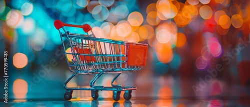 A colorful shopping cart in front of a bokeh light background photo