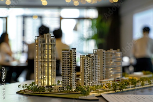 A meticulously detailed model captures the ambitious vision of an unfinished real estate project in China, displayed in a corporate meeting room