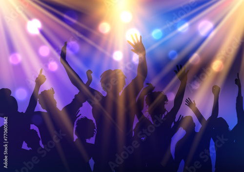Silhouette of a party audience under spotlights 