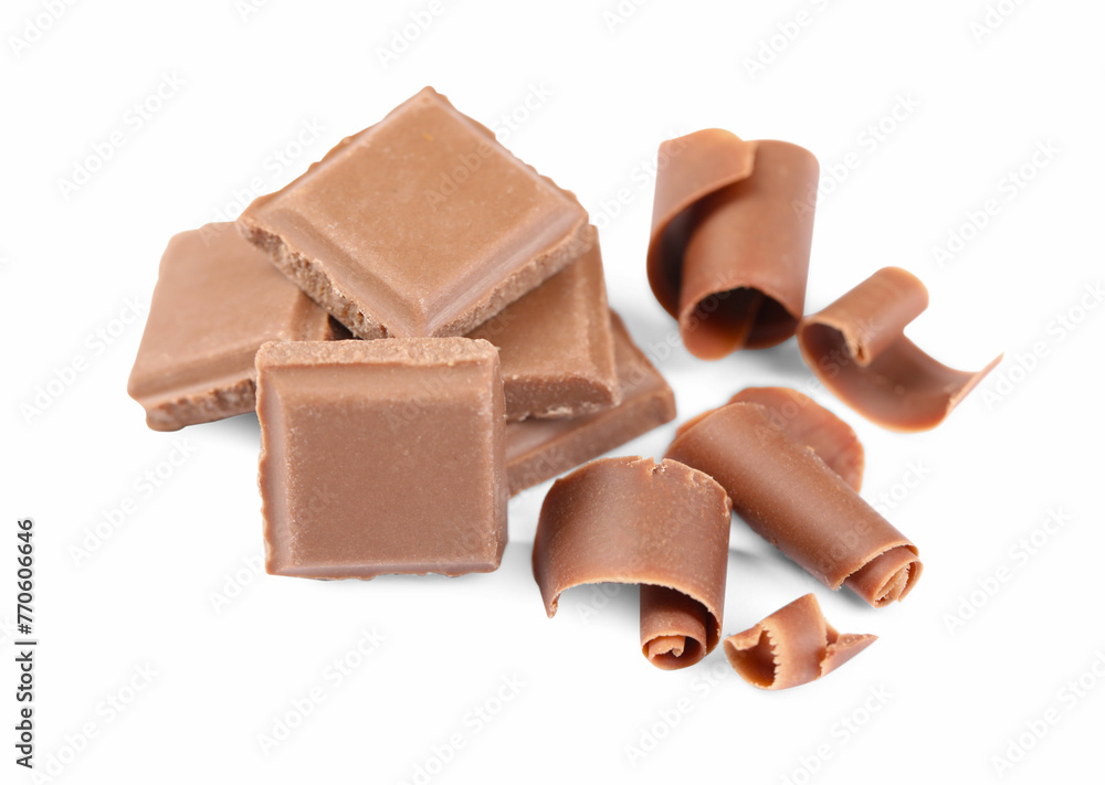Delicious chocolate shavings and pieces isolated on white Delicious chocolate shavings and pieces isolated on white
