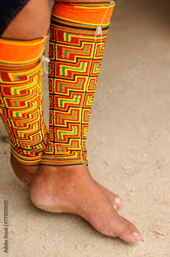 Feet of a traditional Kuna women at the San Blas Islands archipelago in Panama (native of Panamá) with traditional leg band of beads, Guna Yala, Panama - stock photo photo