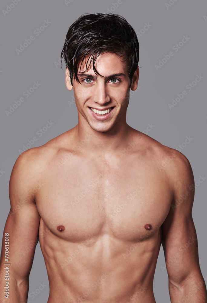 Man, portrait and muscle smile in studio for workout transformation or strong chest, grey background or bodybuilder. Male person, model and face on mockup space for fitness abs, wellness or health Man, portrait and muscle smile in studio for workout transformation or strong chest, grey background or bodybuilder. Male person, model and face on mockup space for fitness abs, wellness or health