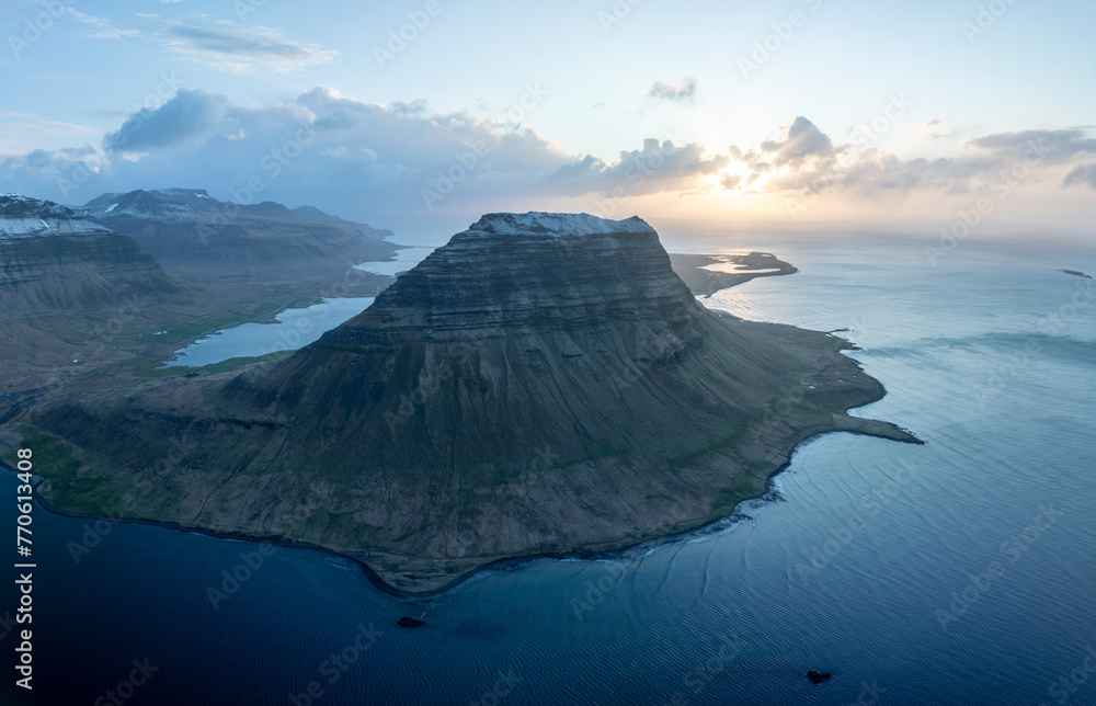 Aerial view of Kirkjufell mountain and Kirkjufellsfossar waterfall in Grundarfjordur, Western Region, Iceland. Aerial view of Kirkjufell mountain and Kirkjufellsfossar waterfall in Grundarfjordur, Western Region, Iceland.