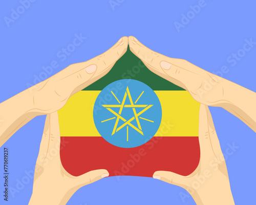 Hand home with Ethiopia flag, residential or investment idea, housing and home concept