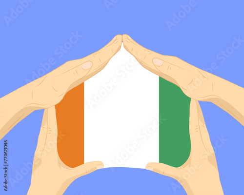Hand home with Ivory Coast flag, residential or investment idea, housing and home concept