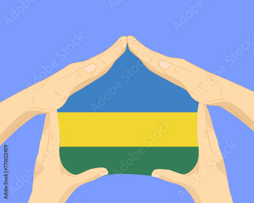 Hand home with Rwanda flag, residential or investment idea, housing and home concept