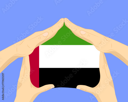 Hand home with UAE flag, residential or investment idea, housing and home concept