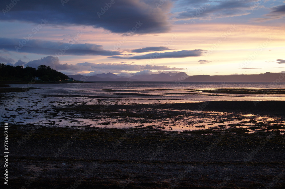 Sunset view across Applecross Bay to Isle of Raasay and the Cuillins on the Isle of Skye. Applecross  Wester Ross, Scottish Highlands Scotland, UK