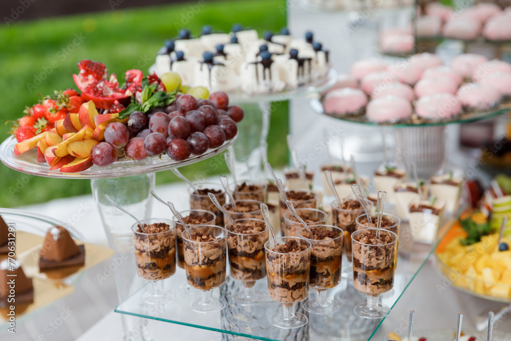 Dessert table filled with cupcakes and sweets Dessert table filled with cupcakes and sweets