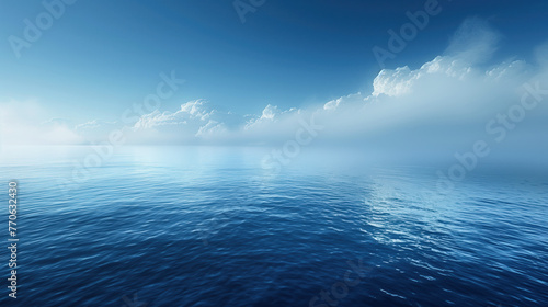 calm sea with soft waves and a horizon flush with a clear sky and diluted with clouds photo