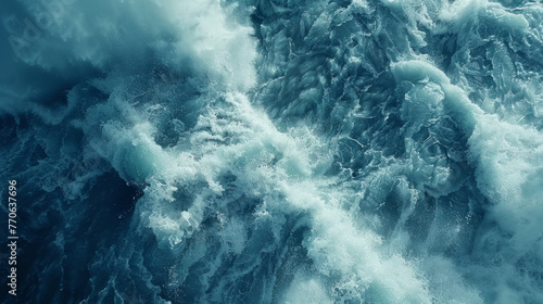 Aerial view of dynamic ocean waves with foam and ripples  capturing the power and texture of the sea in shades of blue and turquoise.