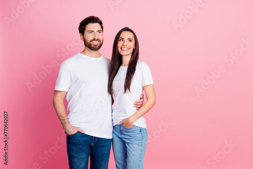 Photo portrait of nice young couple hugging look empty space dressed stylish white outfit isolated on pink color background