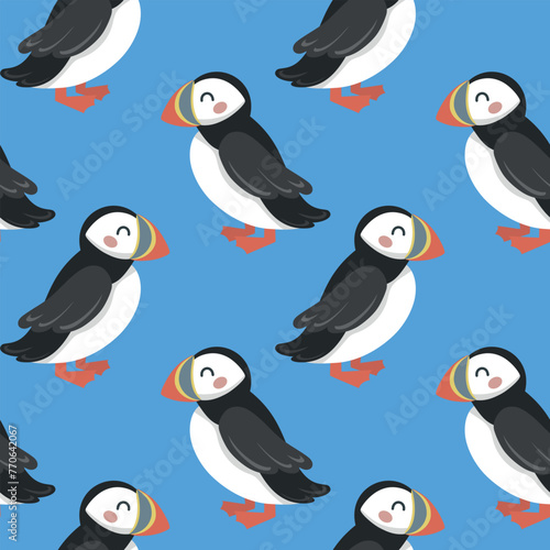 Seamless pattern with cute hand draw cartoon puffin on blue background. Design for printing  textile  fabric. Vector illustration