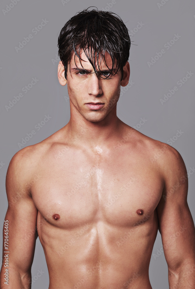 Man, portrait and muscle confidence in studio for workout transformation or strong chest, grey background or bodybuilder. Male person, model and face on mockup space for fitness, wellness or health Man, portrait and muscle confidence in studio for workout transformation or strong chest, grey background or bodybuilder. Male person, model and face on mockup space for fitness, wellness or health
