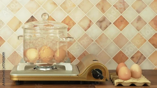 Eggs boiling in a glass pot