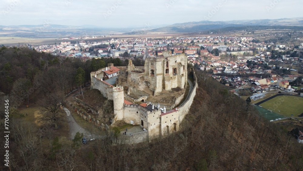 the castle sits on top of a high hill overlooking the town