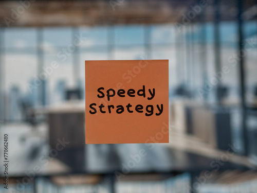 Post note on glass with 'Speedy Strategy'.